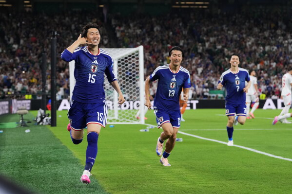 Japan's Daichi Kamada (15) celebrates scoring his side's first goal against Tunisia during the World Cup Group F soccer match in Guadalupe, near Monterrey, Mexico, Saturday, June 20, 2026. (AP Photo/Matias Delacroix)