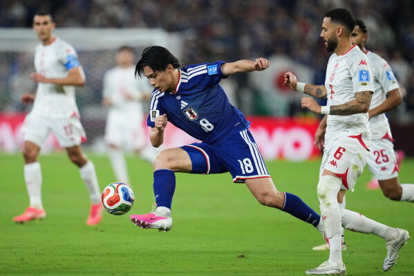 Japan's Ayase Ueda controls the ball during the World Cup Group F soccer match against Tunisia in Guadalupe, near Monterrey, Mexico, Saturday, June 20, 2026. (AP Photo/Matias Delacroix) CORRECTION: Corrects player at center to Japan's Ayase Ueda (18), instead of Takefusa Kubo.