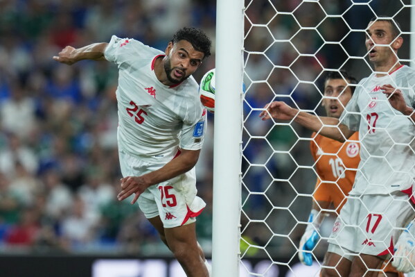 Tunisia's Sebastian Tounekti fails to stop Japan's Ayase Ueda from scoring Japan's fourth goal during a World Cup Group F soccer match in Guadalupe, near Monterrey, Mexico, Saturday, June 20, 2026.(AP Photo/Dolores Ochoa)