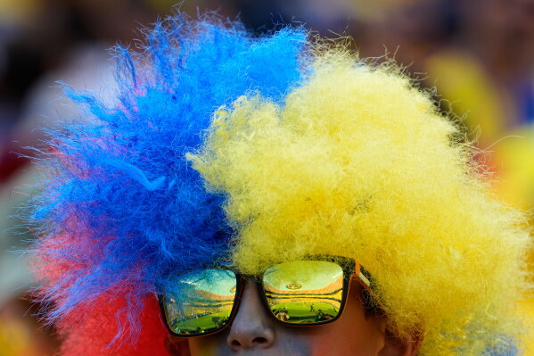 An Ecuadorian fan waits for the beginning of the World Cup Group E soccer match between Ecuador and Curacao in Kansas City, Mo., Saturday, June 20, 2026. (AP Photo/Charlie Riedel)