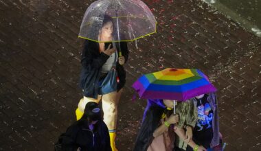 Rain falls as spectators depart after the Dallas Pride Sunset Parade in Dallas, Saturday, June 6, 2026.