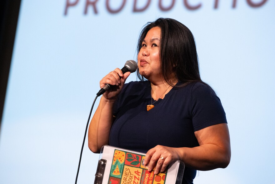 Christine Hoang, founder of Color Arc Production emcee’s the Color Arc’s 4th annual storytelling show: Stories about Pizza at AFS Cinema on Thursday, June 18, 2026. Patricia Lim/KUT News