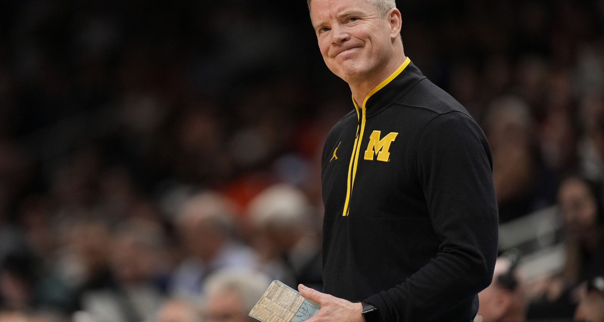 Michigan head coach Dusty May watches play against Auburn during the second half in the Sweet 16 of the NCAA college basketball tournament, Friday, March 28, 2025, in Atlanta. (AP Photo/George Walker IV)