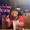 Rinta Goto, a tourist from Japan, enjoys what he describes as "insanely good" bread at Texas Roadhouse in Dallas.