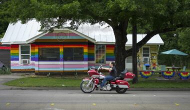 Traffic passes Liam Yesko’s rainbow painted home in Haltom City, Saturday, June 6, 2026.  Yesko painted his Haltom City house to support the LGBTQ community during Pride month after Gov. Greg Abbott required cities to remove all rainbow crosswalks.