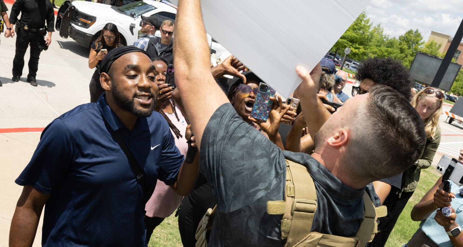 Pardoned U.S. Capitol rioter Jake Lang is confronted by a supporters of Karmelo Anthony outside of the Collin County Courthouse as Anthony’s murder trial is underway in McKinney, TX, Thursday, June 4, 2026. Anthony is accused of killing 17-year-old Austin Metcalf last April at a Frisco track meet at David Kuykendall Stadium.