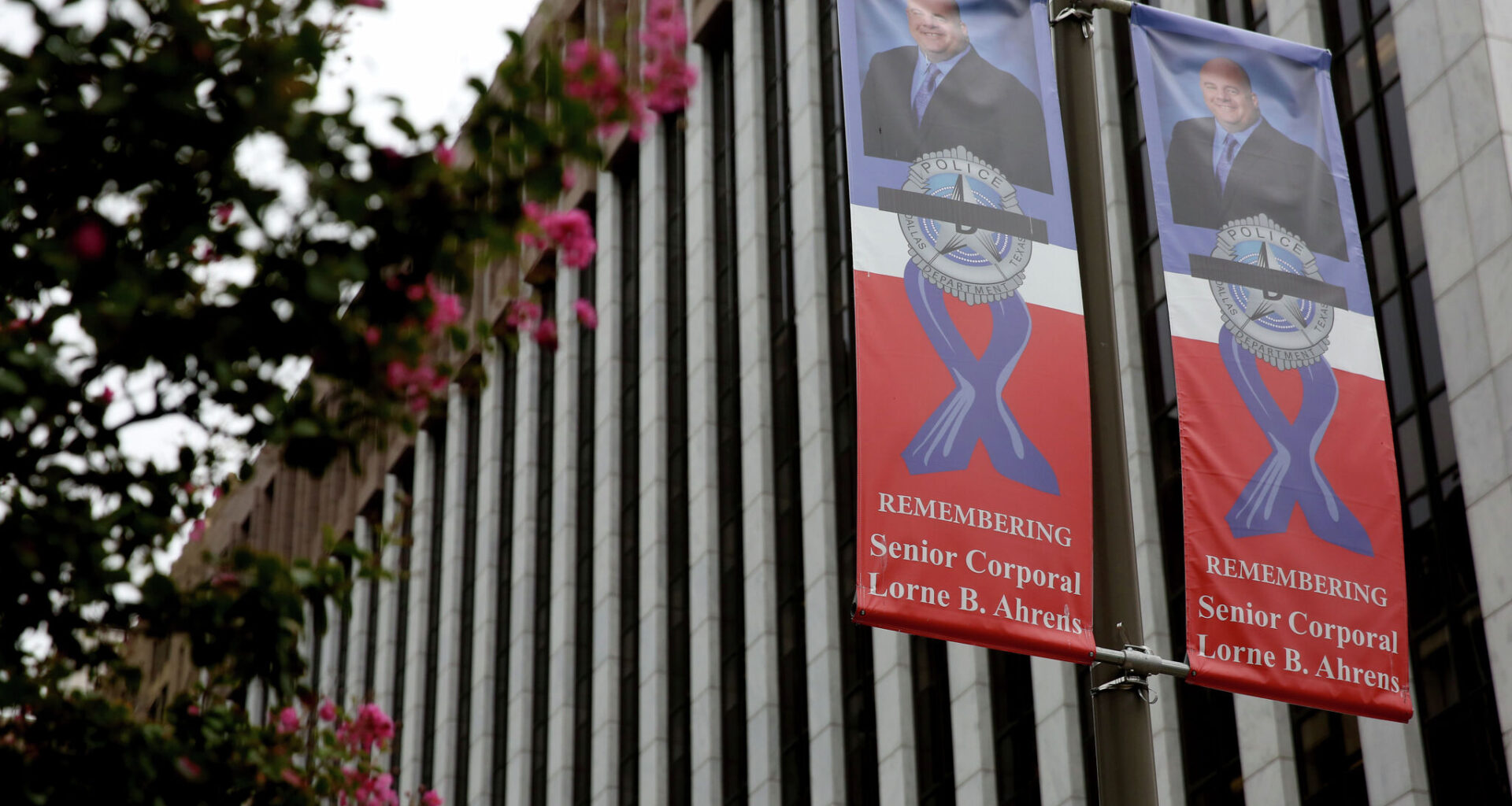 A banner honoring slain Dallas police officer Lorne Ahrens hangs near El Centro College in downtown Dallas on Sept. 26, 2016. Banners honoring the five police officers killed in the July 7 ambush line some of the downtown Dallas streets as a reminder of the officers' heroism. (Rose Baca/The Dallas Morning News)