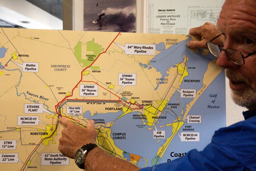 John Michael, vice president of Hanson Professional Services in Corpus Christi, explains a map of Corpus Christi's water supply and distribution system in his office in May.