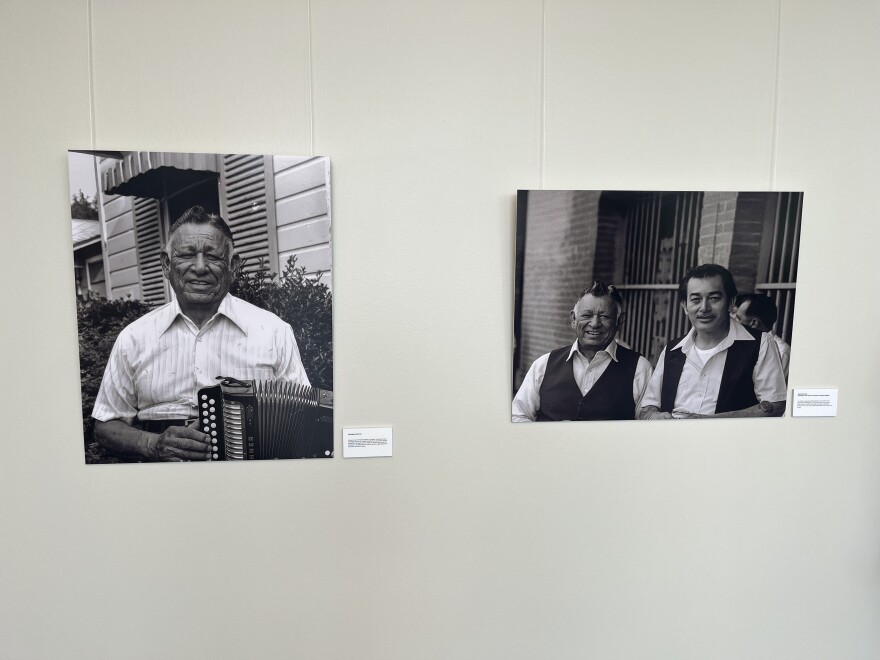 Historical photos of Flaco Jimenez's father, Santiago Jimenez, Sr., and father and son at the Tejano Conjunto Festival in downtown San Antonio, displayed at the Common Ground Gallery at Alamo Colleges for the "From the West Side to the World: Un Homenaje a Flaco Jimenez" exhibit through July 31, 2026