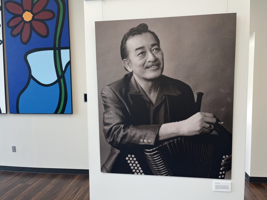 An enlarged photograph of a young Flaco Jimenez, originally displayed at his memorial held on August 7, 2025, at the Carver Community Cultural Center and now at the Common Ground Gallery at Alamo Colleges for the "From the West Side to the World: Un Homenaje a Flaco Jimenez" exhibit through July 31, 2026