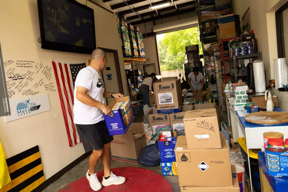 Jesus Nunez, owner of MeetaBox Cargo in Katy, Texas, helps sort donated food, hygiene supplies and other essentials during a donation drive on Thursday.