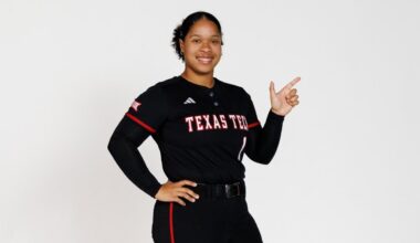 Zoie Bernard posing with the guns up on a photoshoot