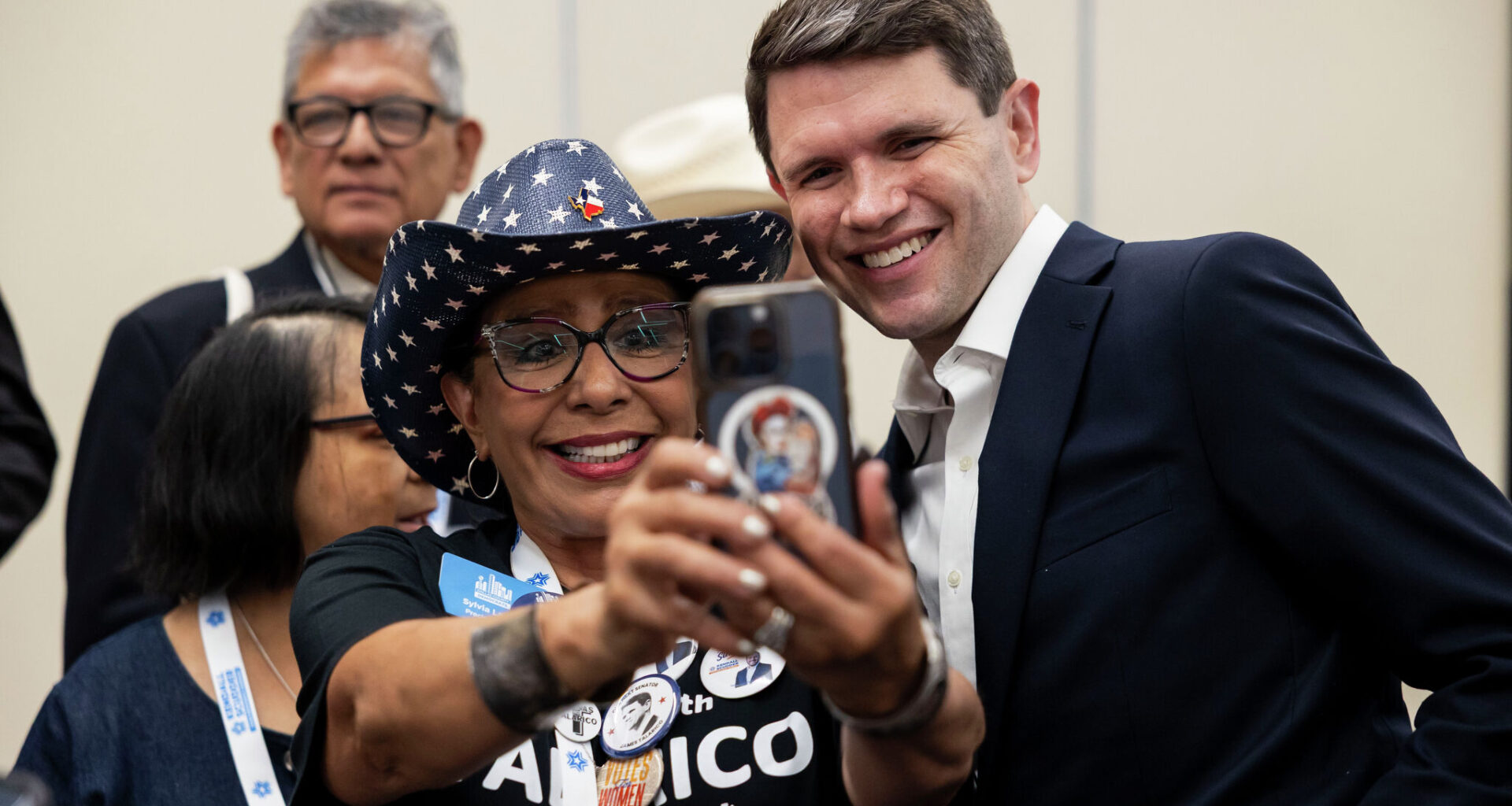 Texas Democratic Senate candidate James Talarico takes a photo Friday with Sylvia Lagos at the Hispanic Caucus during the state Democratic convention in Corpus Christi.