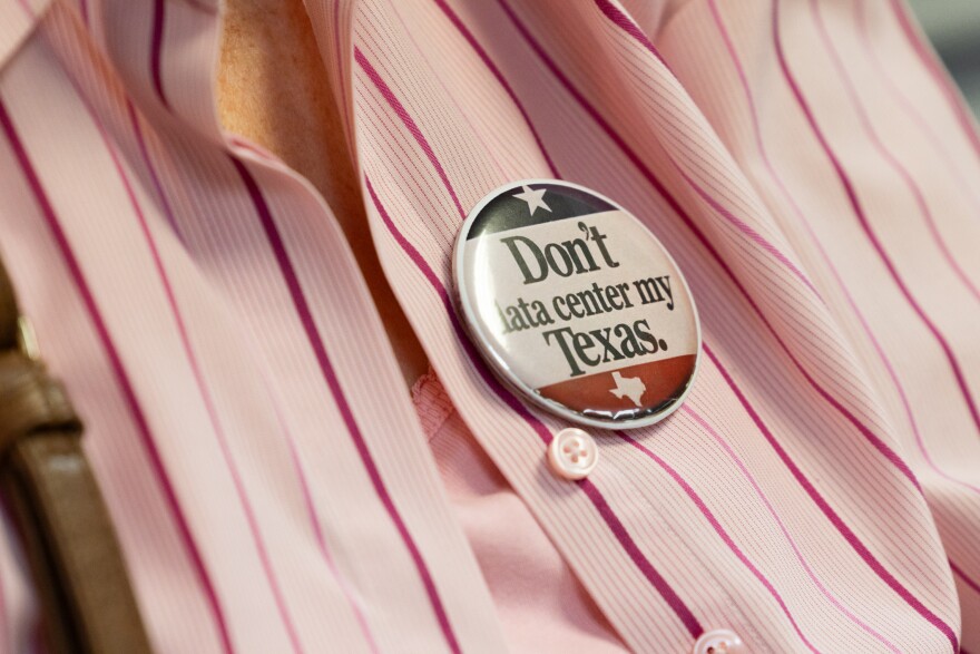 A person wears a “Don’t Data center my Texas” pin 