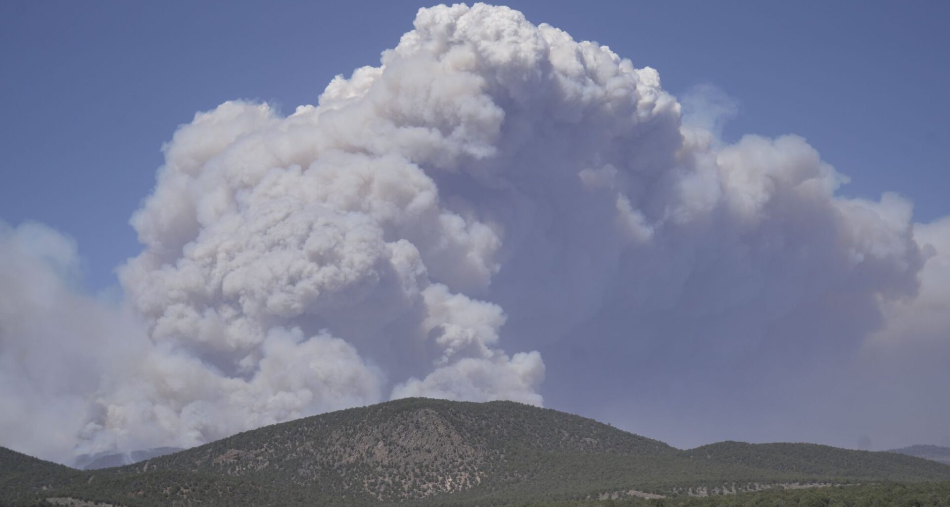 Dangerous weather hampers firefighters and leads to fireworks bans in western US