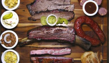 Barbecue and sides from The Original Black's Barbecue in New Braunfels. Clockwise from top left: mac and cheese, brisket, jalapeño-cheese sausage, beef sausage, peach cobbler, pork spare ribs, creamed corn, pinto beans, potato salad and a beef rib.