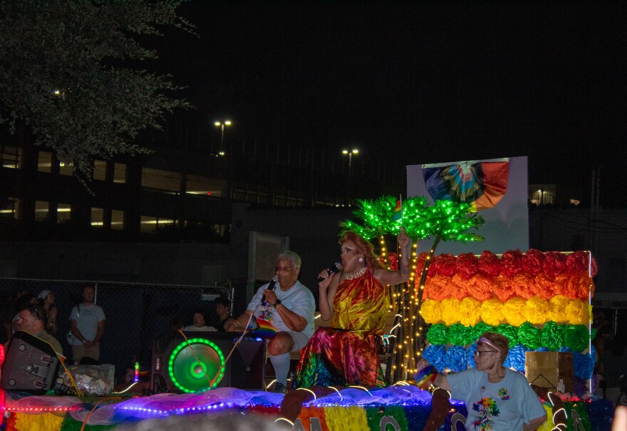 A local drag queen hyped up the Pride Parade crowd while riding on a floaty.