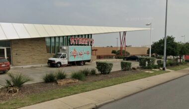 P. Terry's guests hold up complimentary T-shirts with a sign saying goodbye to the chain's Capital Plaza location off Interstate 35 in Austin on Friday, June 26. 
