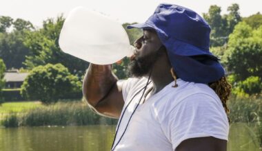 Alexander Nixon of Dallas drinks water while working out at White Rock Lake, Monday, July 17, 2023 in Dallas.