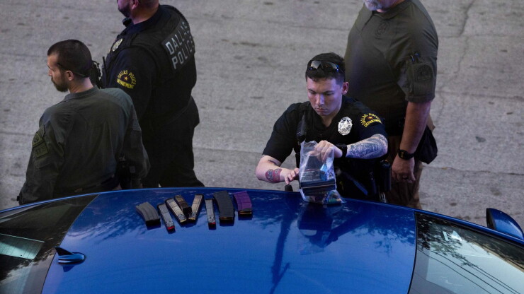 Dallas police officer handles evidence