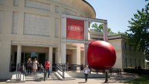July 10, 2014; Memphis, TN, USA;  A giant inflatable ball made for the RedBall Project by aritst Kurt Perschke sits wedged in front of the Memphis Brooks Museum of Art. Perschke's creation has travelled the globe, and will spend ten days in Memphis, being stuffed into different locations around the city each day from the New Daisy Theatre to the Stax Museum; Mandatory credit: Brandon Dill-USA TODAY NETWORK via Imagn Images