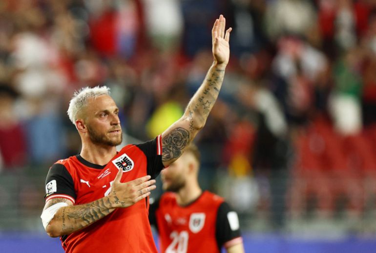 Austria's Marko Arnautovic celebrates after the match