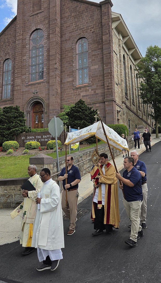 Rev. Kevin Bobbin, escorted by Knights of Columbus, leaves St. John the Baptist in Corpus Christi procession on June 7, 2026. RON DEVLIN/STAFF PHOTO