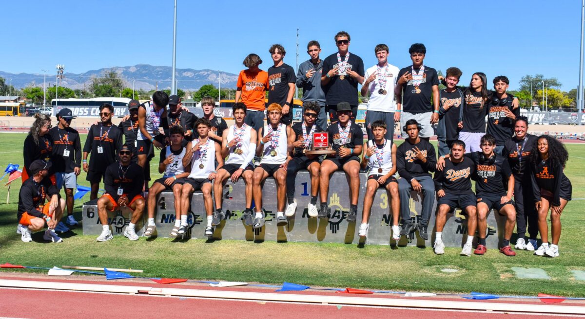 The Artesia boys track team poses with the red trophy after finishing second at the state meet on Saturday, May 16.