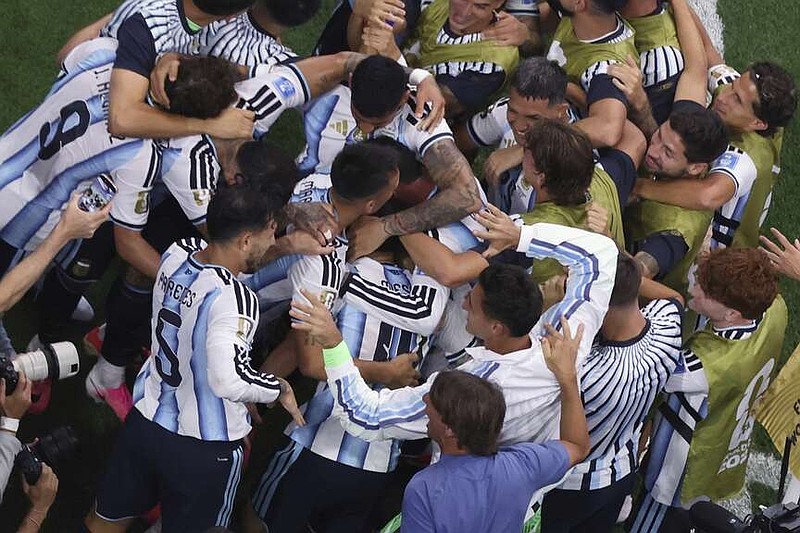 Argentina players celebrate after Lionel Messi scored their second goal during the World Cup Group J soccer match between Argentina and Austria in Arlington, Texas, near Dallas, Monday, June 22, 2026. (AP Photo/Sam Hodde)