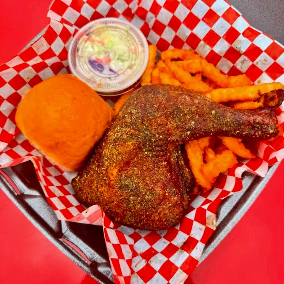 A lemon-pepper rub chicken thigh and leg ar Ribbee’s in Fort Worth.