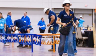 Yesenia Carmona, a junior civil engineering major at The University of Texas at El Paso, carries tools to her team during the assembly phase of the 2026 Student Steel Bridge Competition National Finals on May 22. For the first time, the UTEP Miguel A. Loya College of Engineering served as host of the prestigious annual competition, which challenges students to design, fabricate and construct a scale steel bridge while demonstrating technical expertise, teamwork and efficiency under real-world engineering constraints.