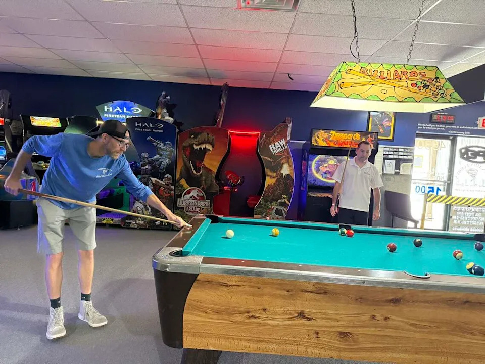 (Left)Richard Bell, the son of Terry Bell and longtime customer (right) Josh Moore play a game of pool in memory of the years they spent play and hanging out at Tornado Terry’s. The Fort Worth business plans on closing after 35-years on August 9, 2026.