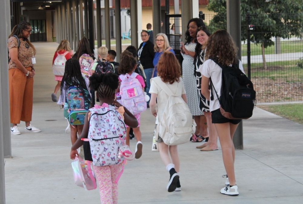 Students enter an Austin ISD campus on Aug. 22, 2024. The district currently faces a $181 million shortfall and is closing 10 campuses. (Sarah Hernandez/Community Impact)