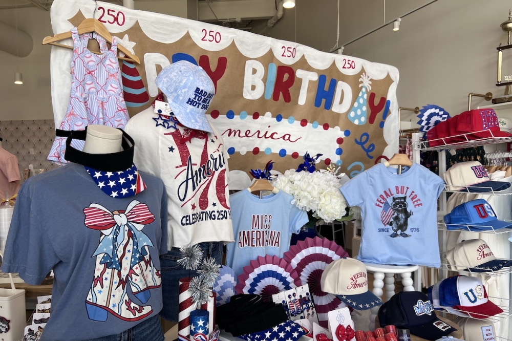 The Drip Swag Shop team created several display tables, including one for Independence Day. (Sierra Martin/Community Impact)
