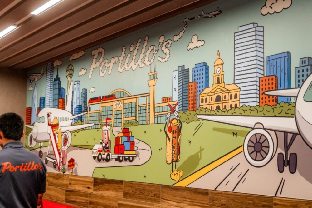 Portillo's launched its first restaurant inside an airport on May 27, with a ribbon-cutting ceremony on May 27 inside Terminal B at Dallas Fort Worth International Airport. (Courtesy Portillo's)