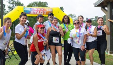Trail runners posing and smiling for a picture