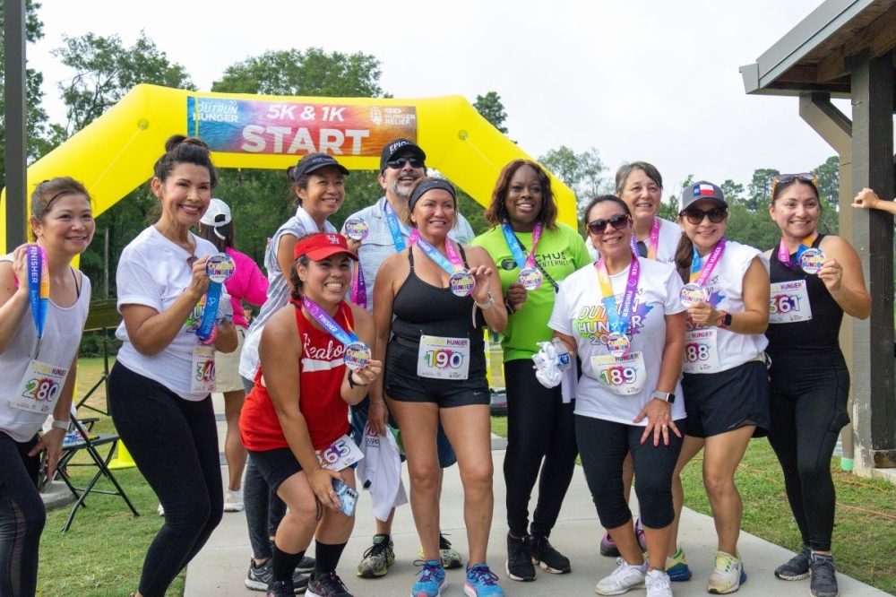 Trail runners posing and smiling for a picture
