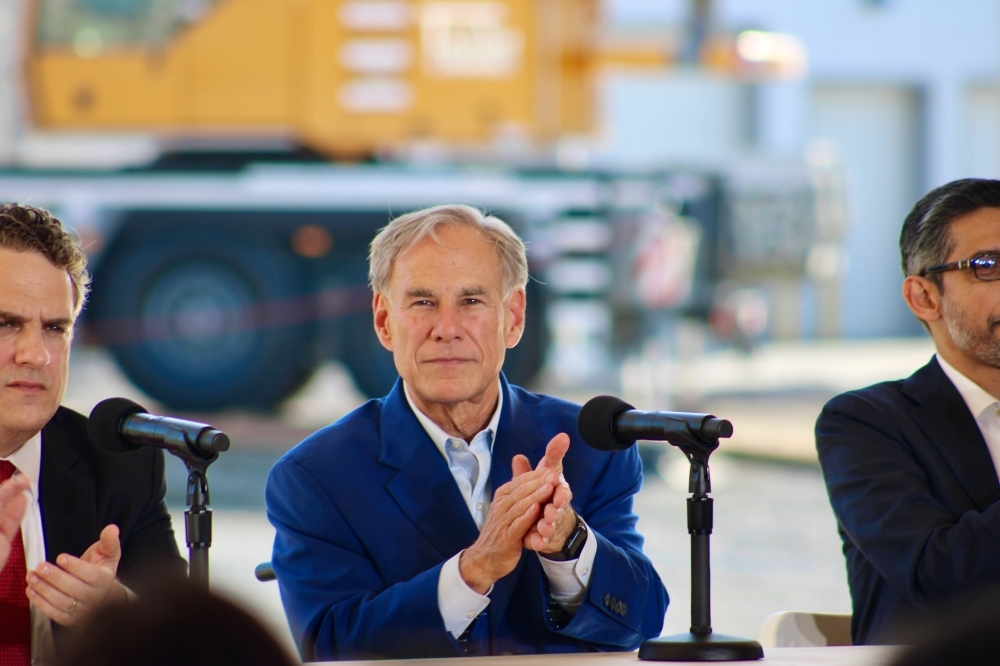 Gov. Greg Abbott, center, is seated next to two other men at a Nov. 14 event at the Midlothian Google Data Center.