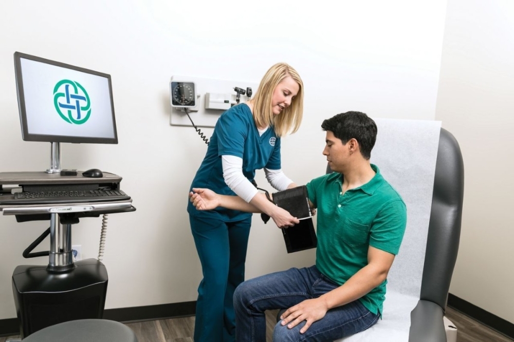a doctor taking a patient's blood pressure
