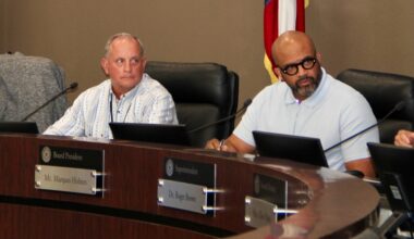 From left, Humble ISD board President Michael Grabowski and Position 6 trustee Marques Holmes deliberate during a board meeting. (Wesley Gardner/Community Impact)