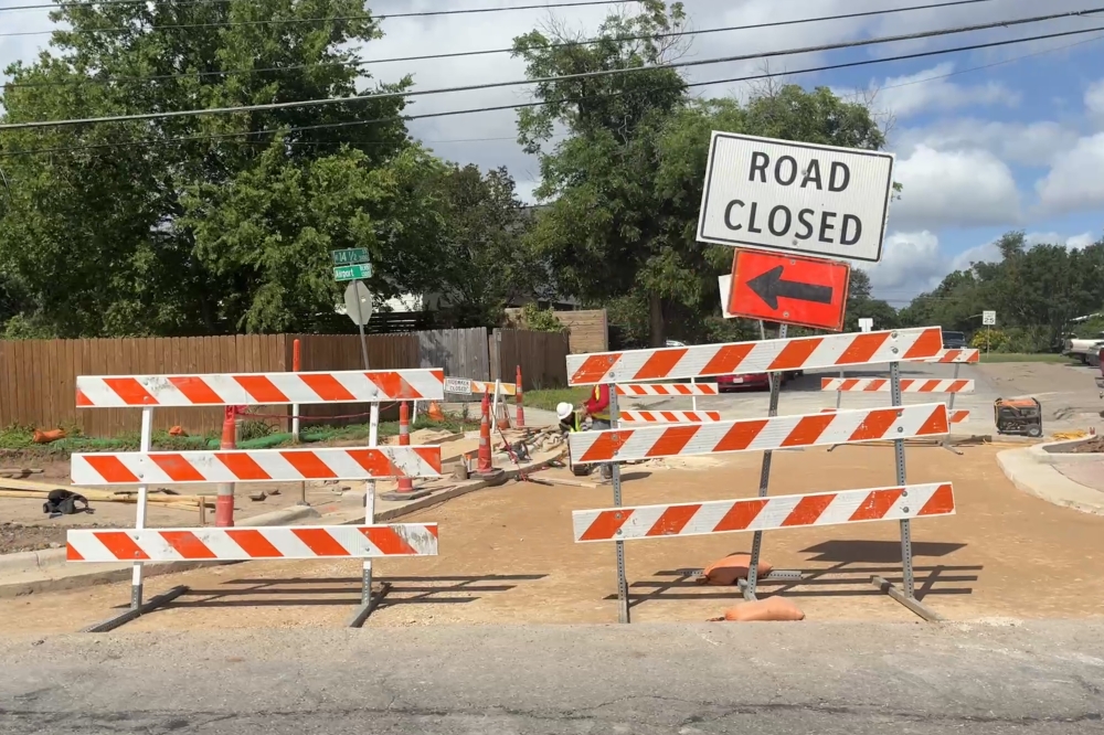 Construction barricades block a road near the intersection of 14th 1/2 Street and Airport Boulevard in East Austin on June 11. (Jessica McLaren/Community Impact)