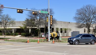 Car driving through traffic signal at Century Parkway and Bethany Drive in Allen