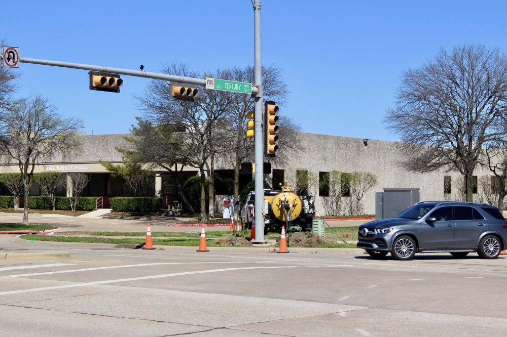 Car driving through traffic signal at Century Parkway and Bethany Drive in Allen