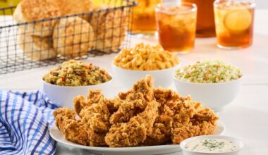 a table full of chicken and sides