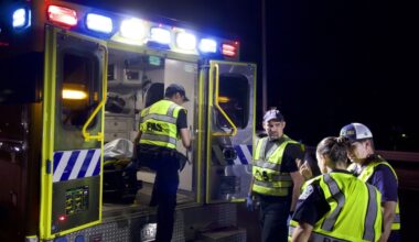 Emergency medical service personnel discuss an incident with a police officer. (Courtesy Austin-Travis County Emergency Medical Services)