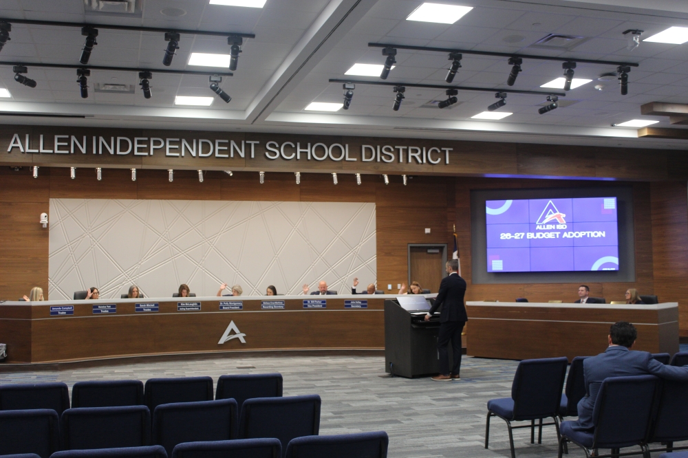 Allen ISD's board of trustees vote to adopt the 2026-27 school year budget during a June 15 meeting held at 610 E. Bethany Drive in Allen. (Colby Farr/Community Impact)