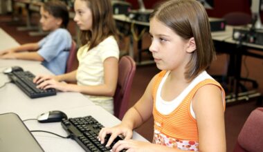 Students in the school library doing research on computers.