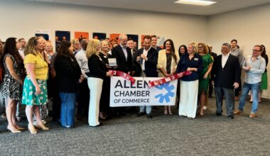 MD7 ribbon cutting with a large group of people