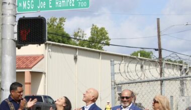 Council member Joaquin Martinez (left) stands next to family members of Joe E. Ramirez and Mayor John Whitmire as they reveal the new street named after the former veteran and community member. (Courtesy Joaquin Martinez via Facebook)