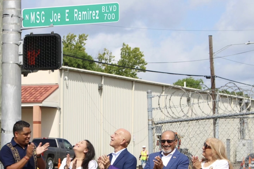 Council member Joaquin Martinez (left) stands next to family members of Joe E. Ramirez and Mayor John Whitmire as they reveal the new street named after the former veteran and community member. (Courtesy Joaquin Martinez via Facebook)